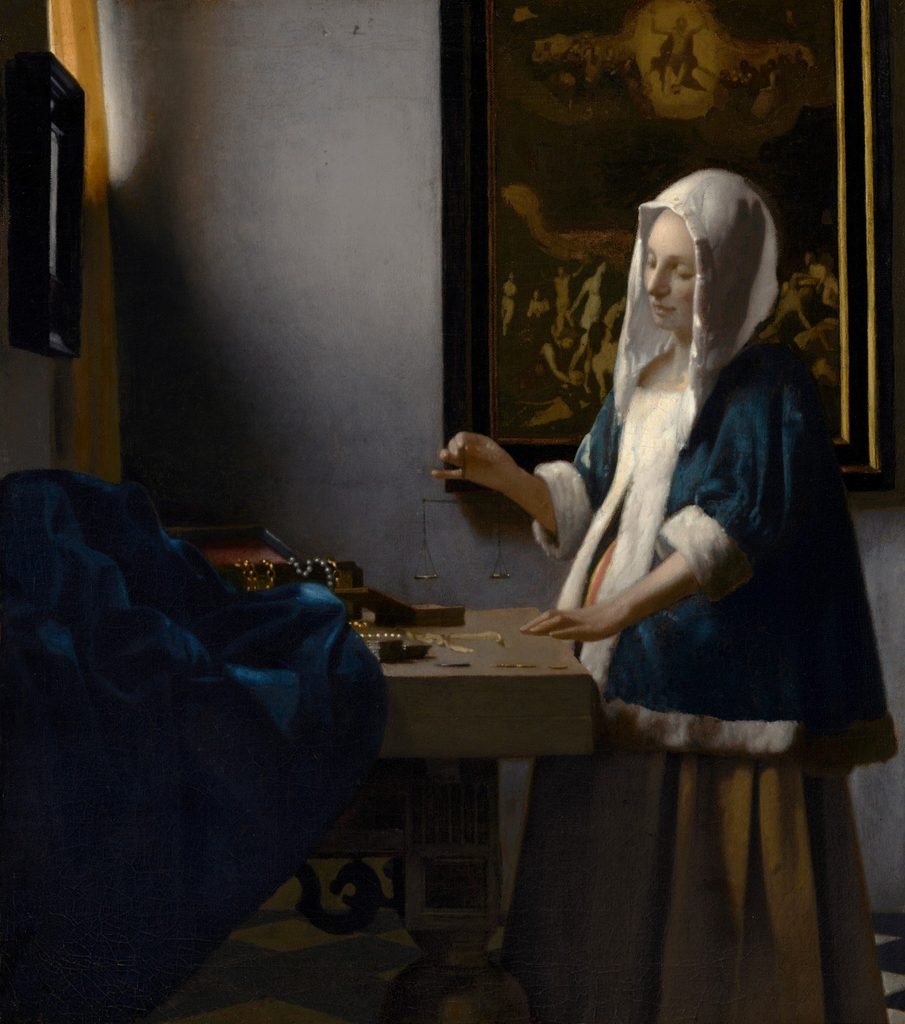Johannes Vermeer’s Woman Holding a Balance, showing a woman holding a small balance beside pearls and gold, with a painting of the Last Judgment behind her.