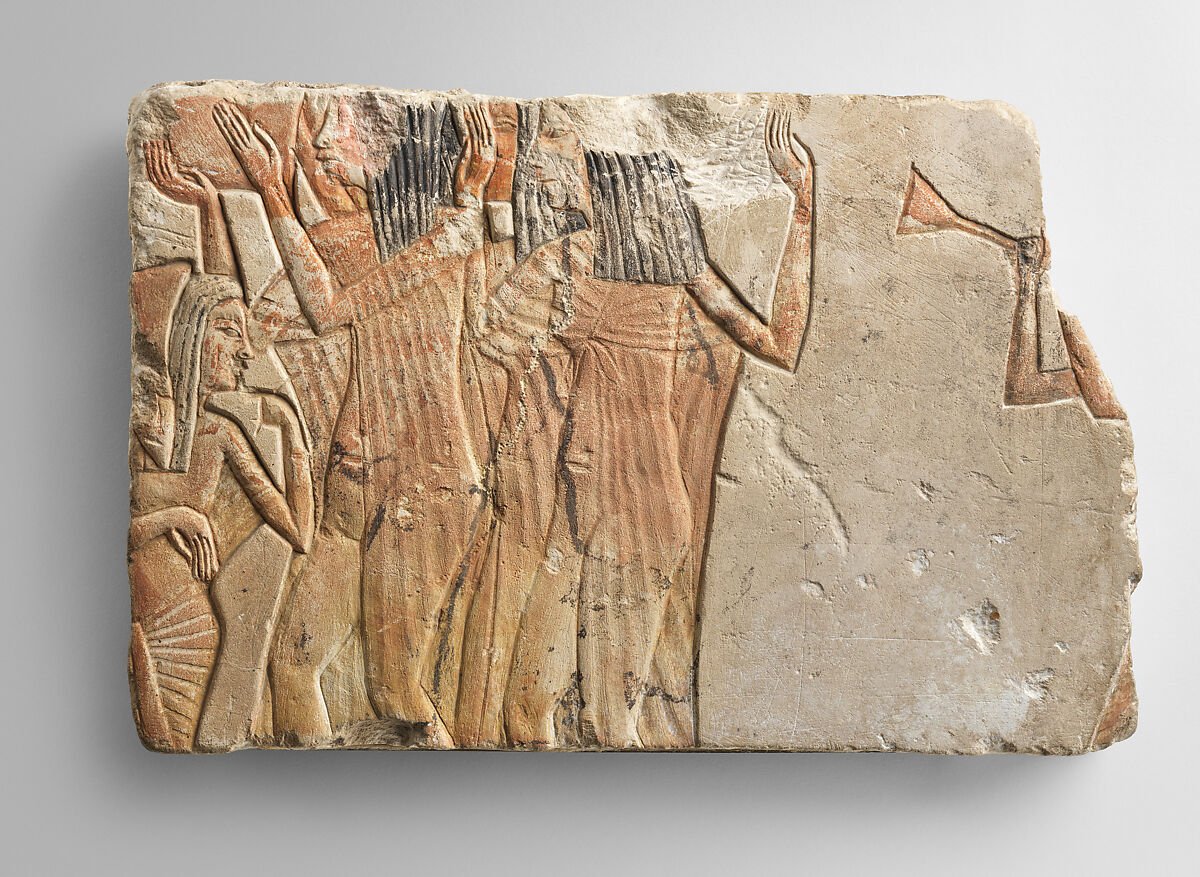 Ancient Egyptian painted limestone relief showing a repeated sequence of standing figures, raised arms, and instruments.